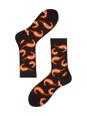 Pair of black crew Shrimp Socks with orange patterns, flat lay on white background